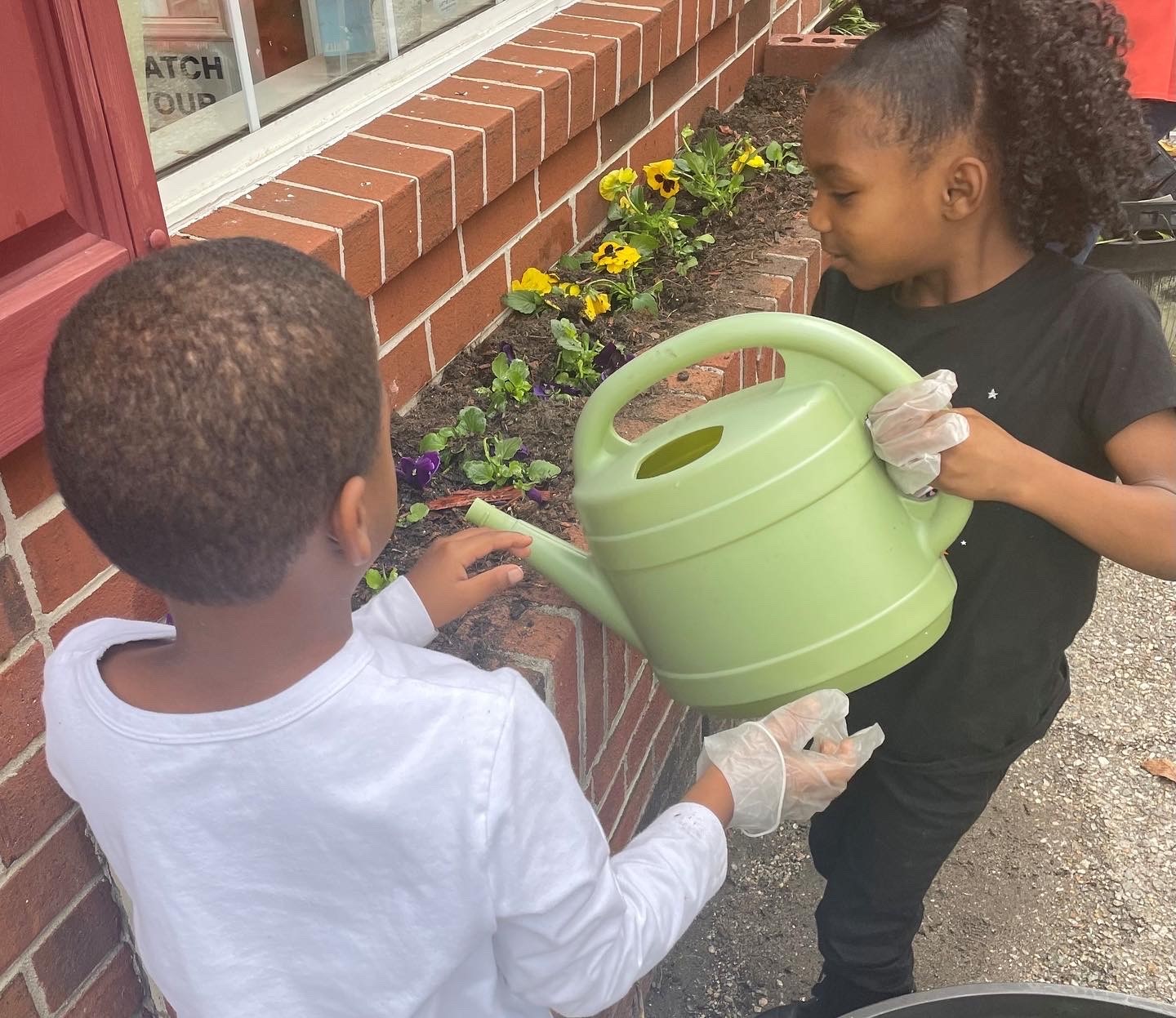 Children watering flowers
