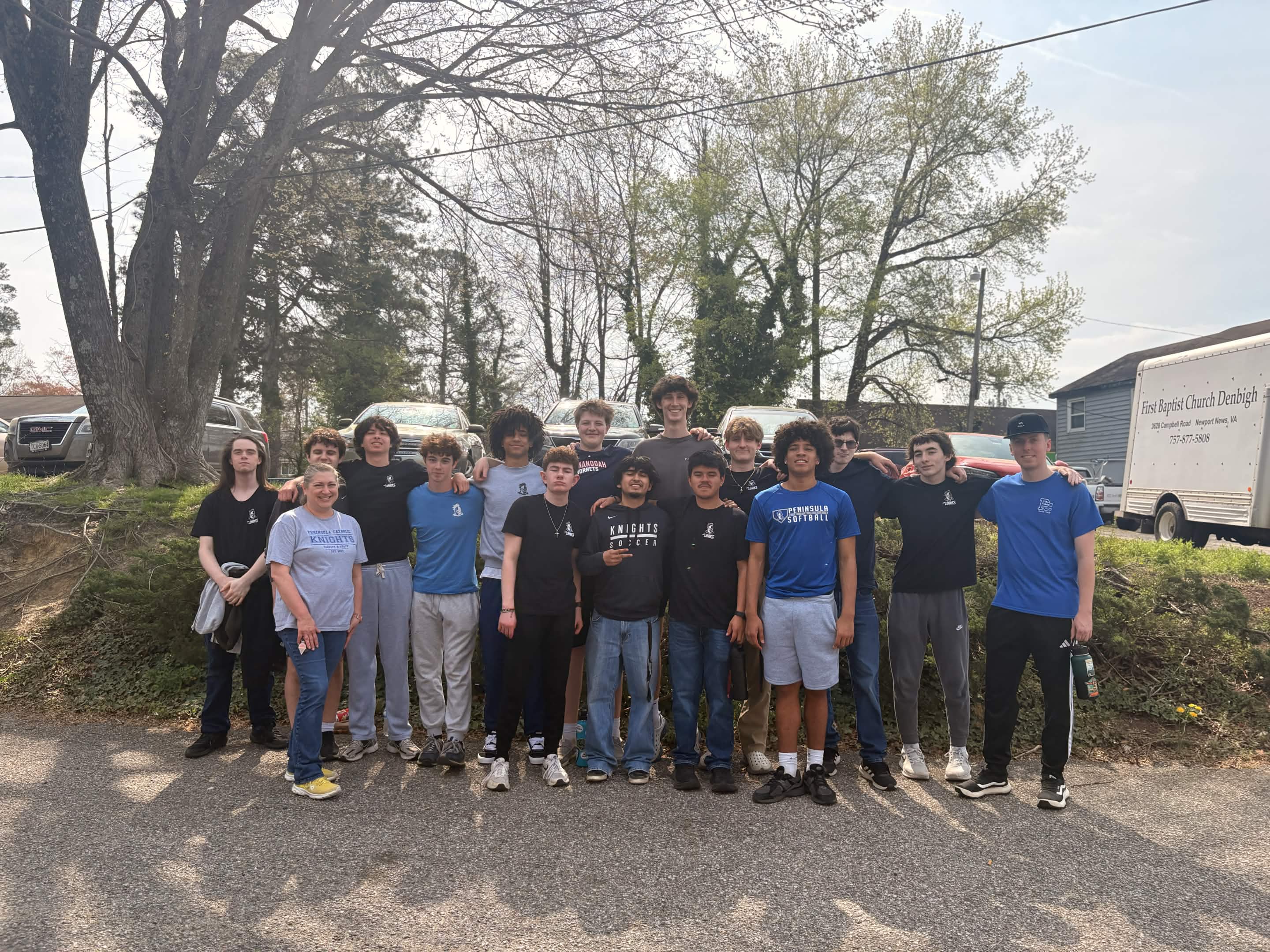 A group of volunteers standing together outside